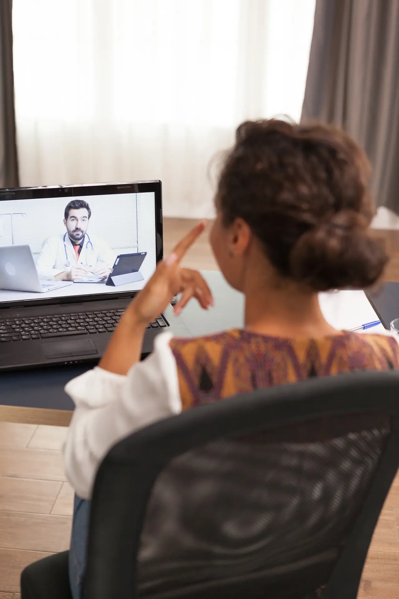 Patient in a video call with doctor